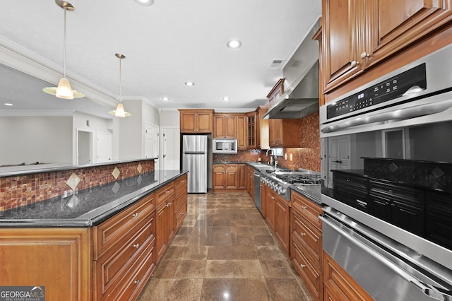 kitchen with tasteful backsplash, decorative light fixtures, dark stone countertops, stainless steel appliances, and range hood