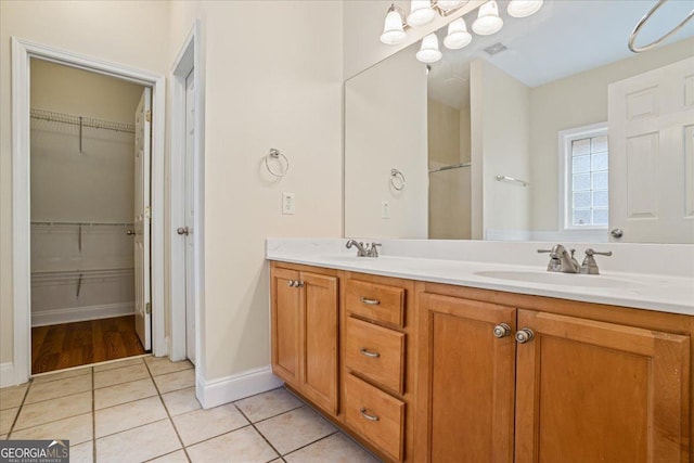 bathroom with vanity and tile patterned flooring