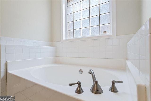 bathroom featuring a relaxing tiled tub