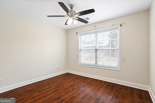 unfurnished room featuring dark hardwood / wood-style flooring and ceiling fan