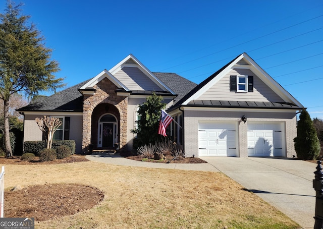 view of front of home with a standing seam roof, brick siding, driveway, and metal roof