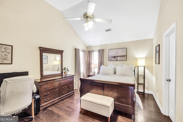 bedroom with dark hardwood / wood-style flooring, vaulted ceiling, and ceiling fan