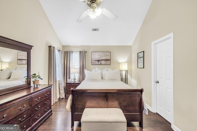 bedroom with vaulted ceiling, dark hardwood / wood-style floors, and ceiling fan