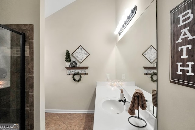 bathroom featuring vanity, an enclosed shower, and tile patterned floors