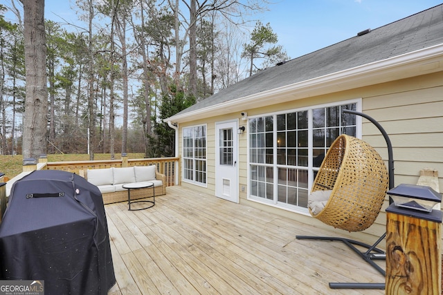 deck featuring an outdoor living space and grilling area