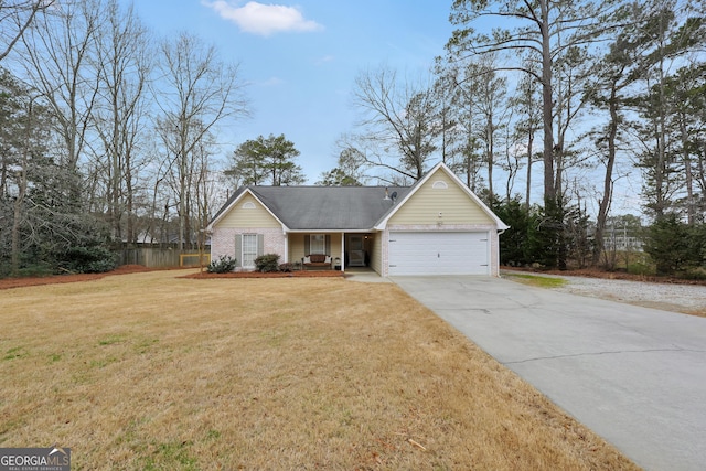 view of front of property with a garage and a front lawn