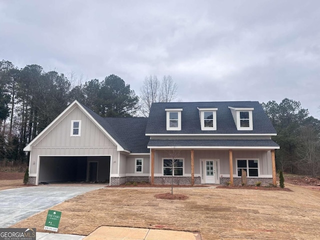 view of front of house with a garage and covered porch