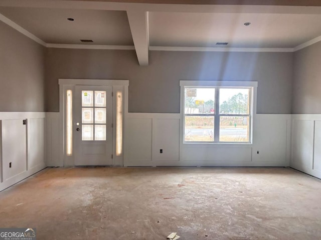 entryway with beam ceiling and crown molding