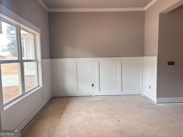 spare room featuring plenty of natural light and ornamental molding