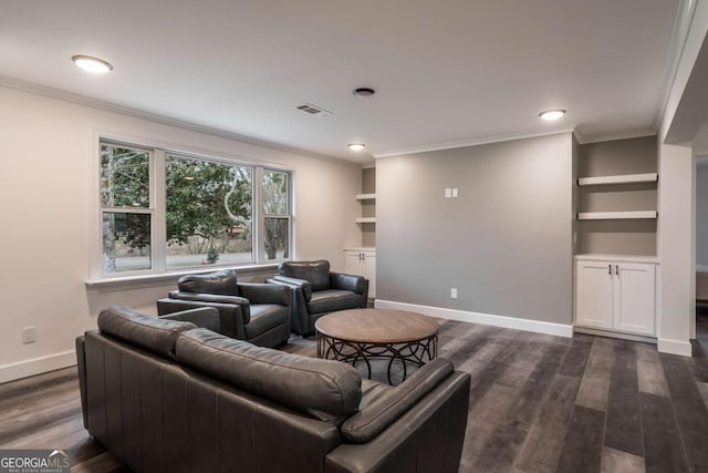 living room featuring dark hardwood / wood-style flooring, built in shelves, and ornamental molding
