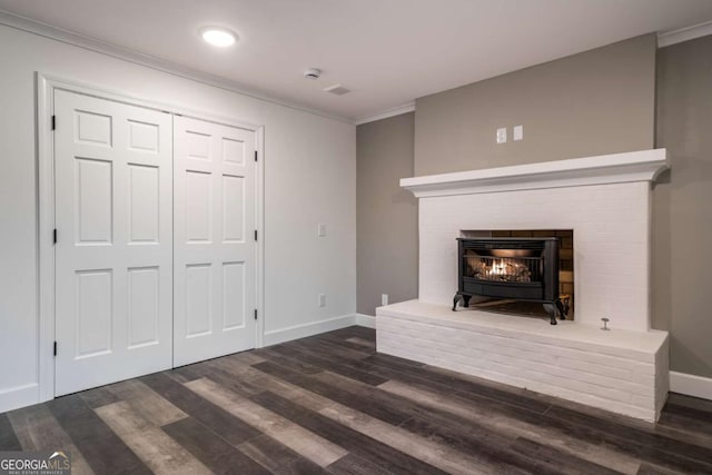 unfurnished living room with dark hardwood / wood-style flooring and ornamental molding