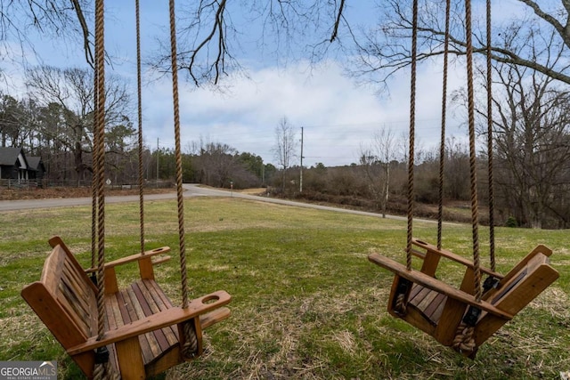 view of home's community featuring a yard
