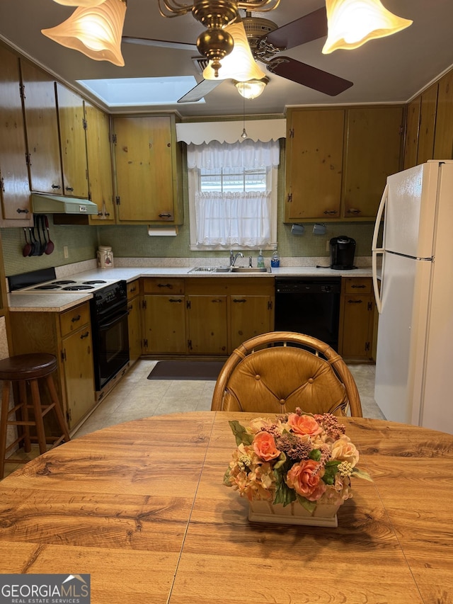 kitchen with electric range oven, black dishwasher, sink, white refrigerator, and ceiling fan