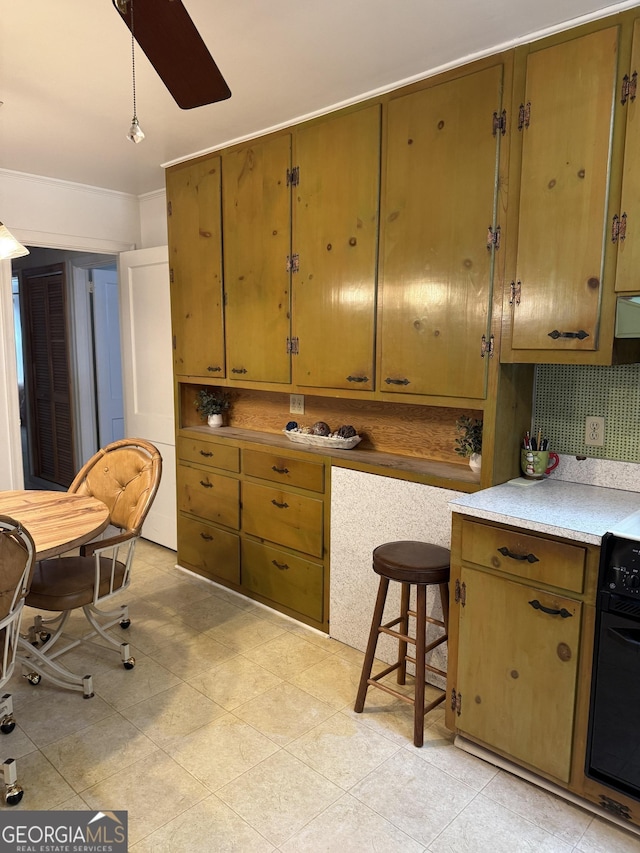 kitchen featuring pendant lighting and black oven