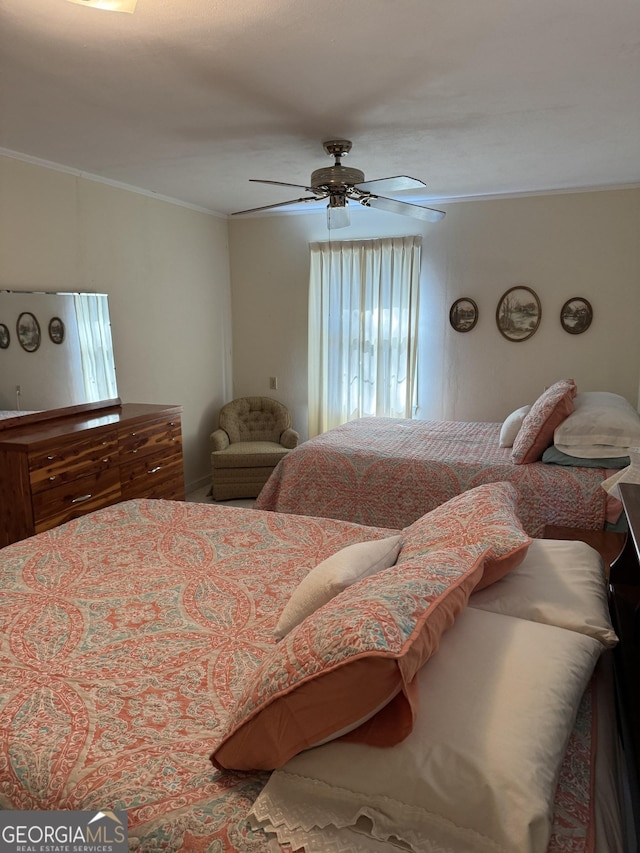 bedroom featuring crown molding and ceiling fan