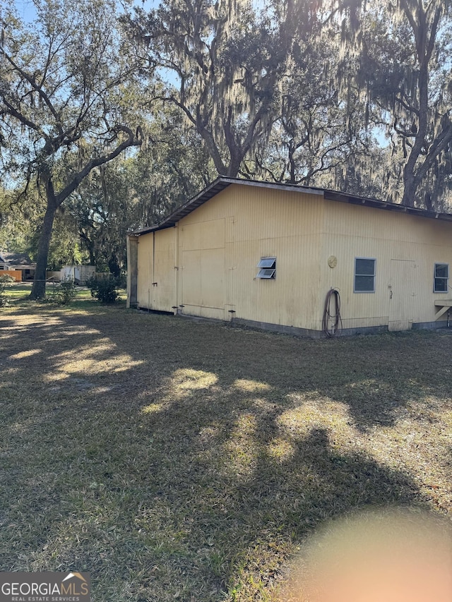 view of home's exterior featuring a lawn