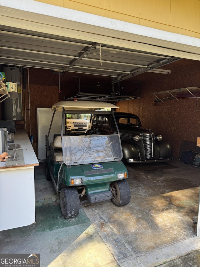 garage with a carport and water heater