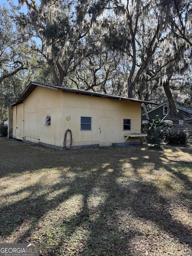 view of home's exterior with a lawn