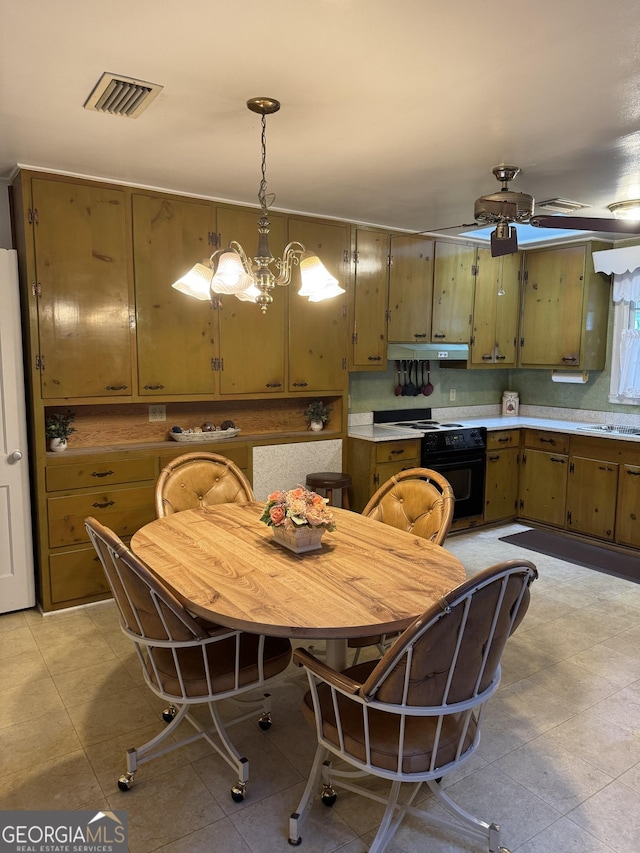 kitchen with hanging light fixtures, black range with electric stovetop, and ceiling fan with notable chandelier