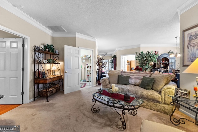 living room with crown molding, light carpet, a textured ceiling, and a notable chandelier