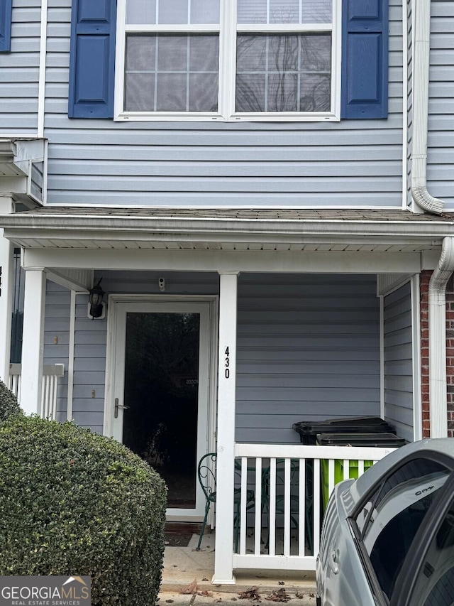 entrance to property with a porch