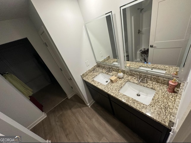 bathroom featuring vanity and hardwood / wood-style floors