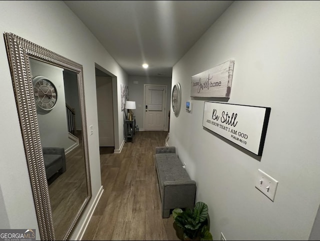 corridor featuring dark hardwood / wood-style flooring