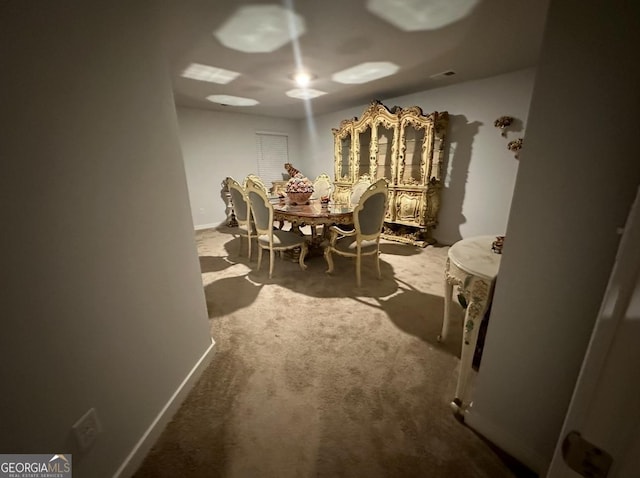 dining space featuring carpet floors