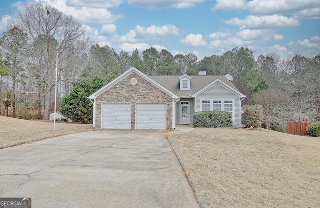 view of front of property with a garage and a front yard