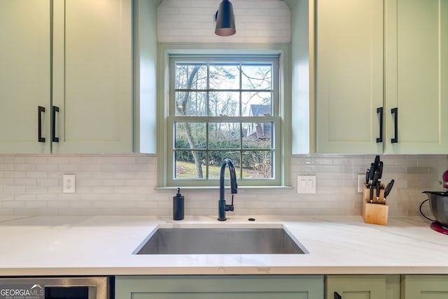 details with sink, wine cooler, backsplash, green cabinets, and light stone countertops