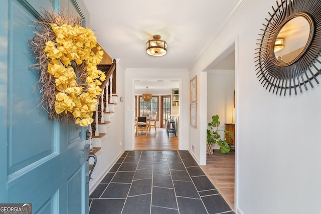 entryway featuring dark wood-type flooring and ornamental molding