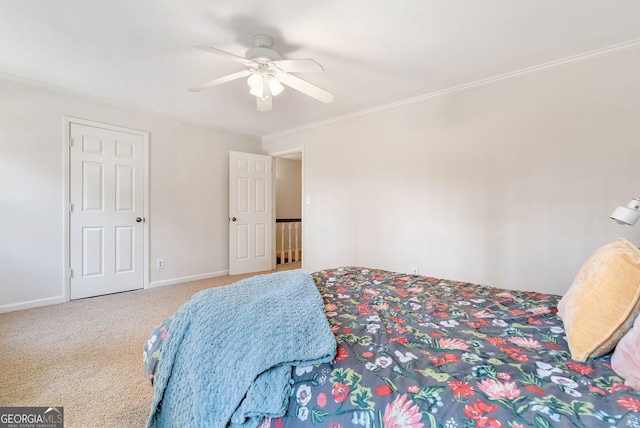 bedroom featuring crown molding, carpet floors, and ceiling fan