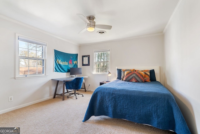 bedroom with carpet floors, ornamental molding, and ceiling fan