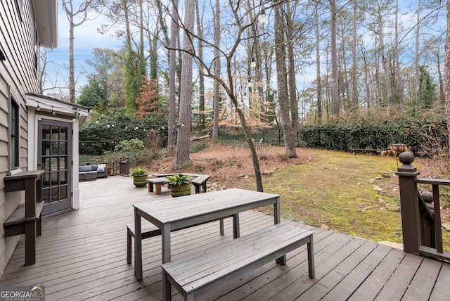 deck featuring outdoor lounge area