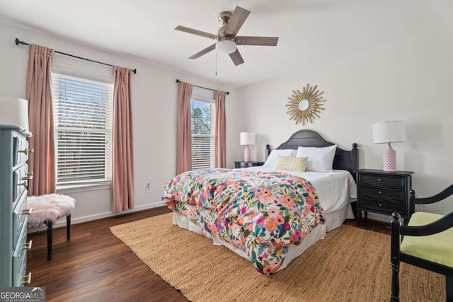 bedroom featuring dark hardwood / wood-style flooring and ceiling fan