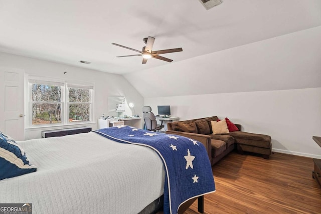 bedroom with lofted ceiling, dark wood-type flooring, and ceiling fan