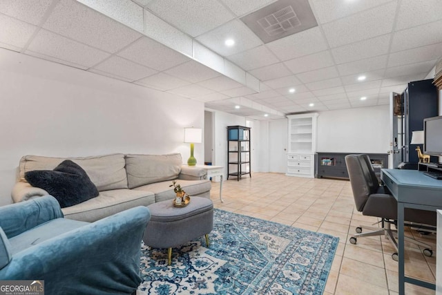 tiled office space featuring a drop ceiling