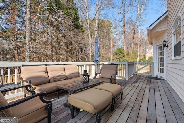 wooden terrace featuring an outdoor hangout area