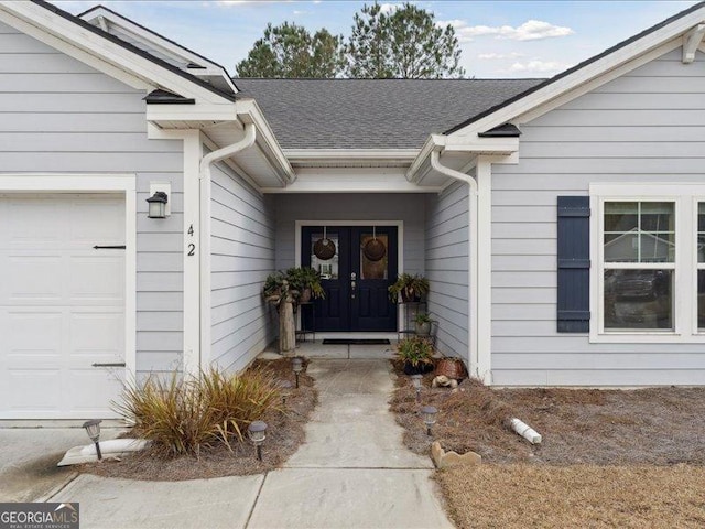 property entrance with a garage