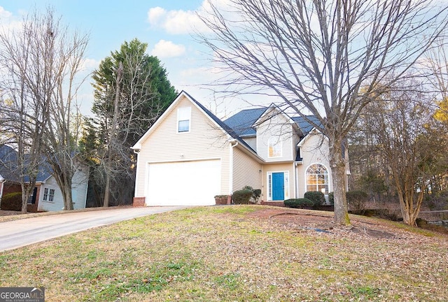 view of front property featuring a garage and a front lawn