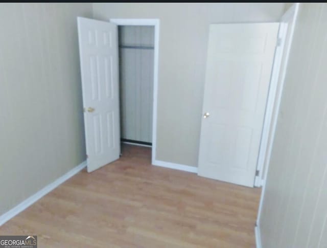 unfurnished bedroom with light hardwood / wood-style flooring