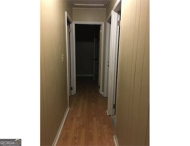 corridor featuring light hardwood / wood-style floors