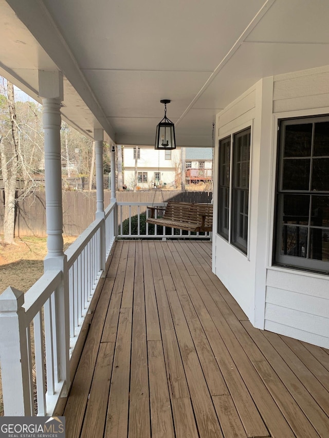 wooden terrace with a porch