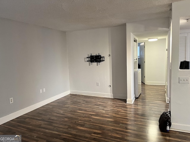 unfurnished room with dark hardwood / wood-style flooring and a textured ceiling