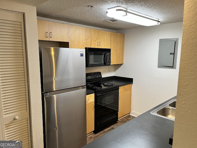 kitchen featuring sink, electric panel, dark hardwood / wood-style floors, black appliances, and a textured ceiling