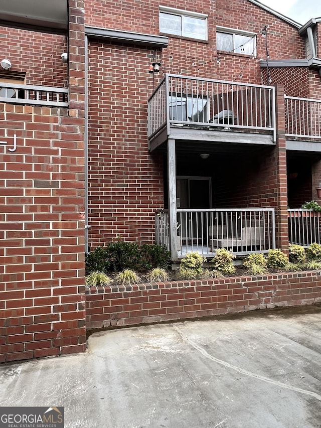 view of side of property with a balcony