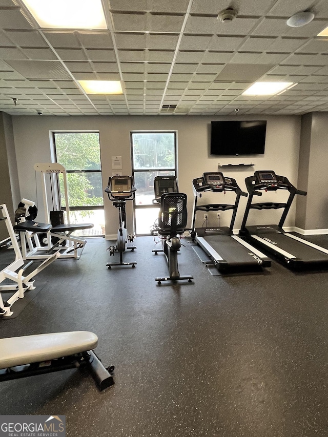 gym featuring a drop ceiling