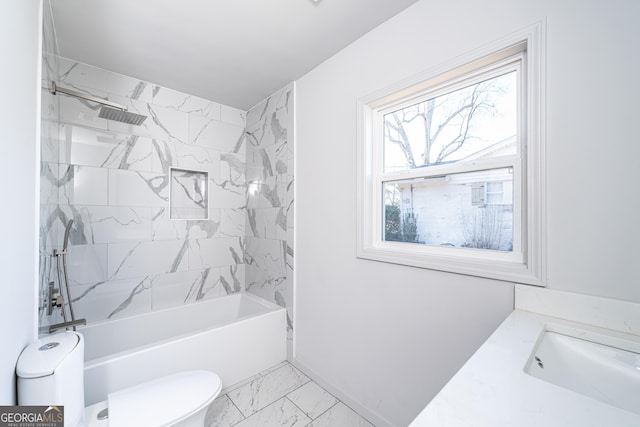 full bathroom featuring sink, tiled shower / bath combo, and toilet