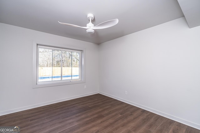 unfurnished room with ceiling fan and dark hardwood / wood-style floors