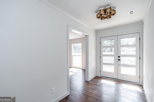 entrance foyer featuring crown molding, dark wood-type flooring, and french doors